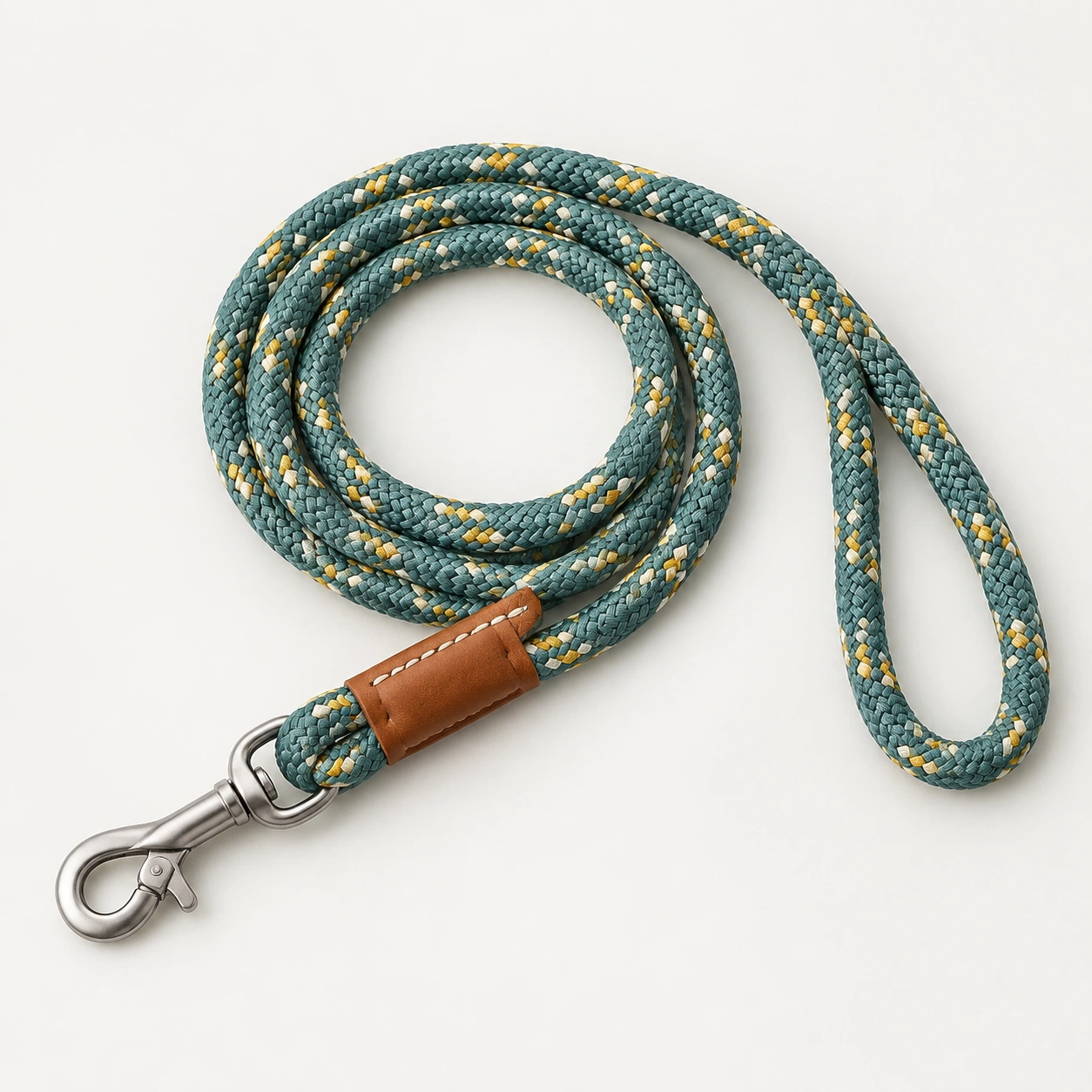 Braided rope dog lead coiled with a metal trigger clip